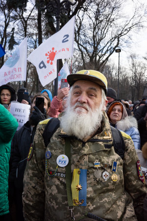 KYIV, UKRAINE - Nov. 24, 2021: Several hundred people protest against coronavirus restrictions and mandatory vaccinations.のeditorial素材