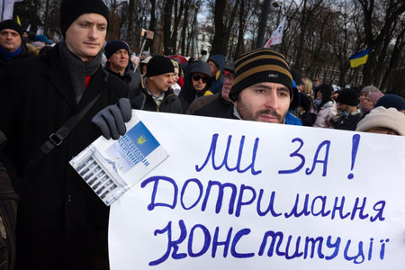 KYIV, UKRAINE - Nov. 24, 2021: Several hundred people protest against coronavirus restrictions and mandatory vaccinations. Text - For constitutional orderのeditorial素材