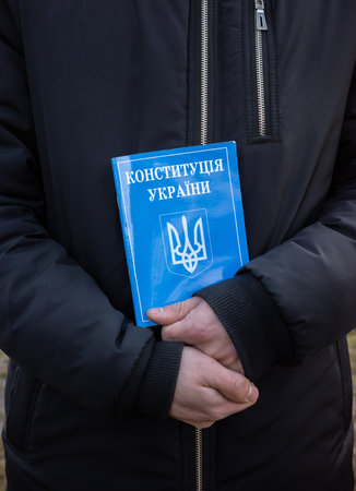 KYIV, UKRAINE - Nov. 24, 2021: Several hundred people protest against coronavirus restrictions and...