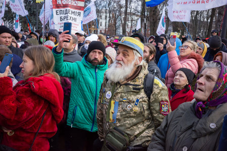 KYIV, UKRAINE - Nov. 24, 2021: Several hundred people protest against coronavirus restrictions and mandatory vaccinations. Text - Epidemic of liesのeditorial素材
