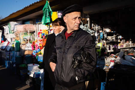 KYIV, UKRAINE - Oct. 31, 2021: Last day of the Demeevsky bazaar in Kyiv before its liquidation. Lots of people have lost their jobs. View of a typical market in Ukraineのeditorial素材