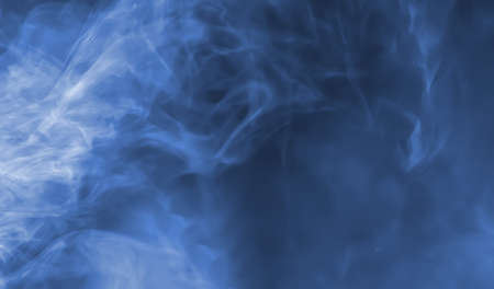 Abstract smoke background. Smoke illuminated beam of light. Image in blue toneの写真素材