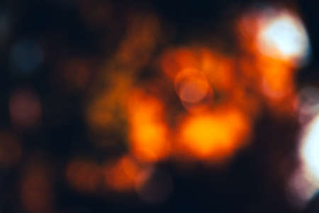 Abstract defocused bokeh background in red tone. nature abstract background.の写真素材