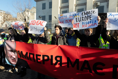 KYIV, UKRAINE - Feb. 22, 2022: The empire must die. Protest action near the Embassy of the Russian Federation in Kiev. Text - Empire must die and Donbas is Ukraineのeditorial素材