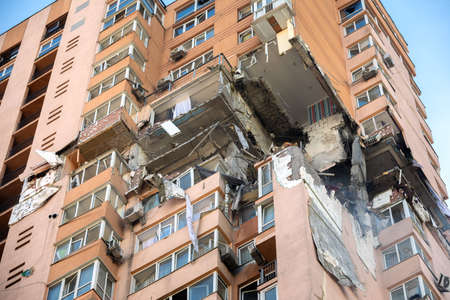 KYIV, UKRAINE - Feb. 25, 2022: War of Russia against Ukraine. View of a civilian building damaged...