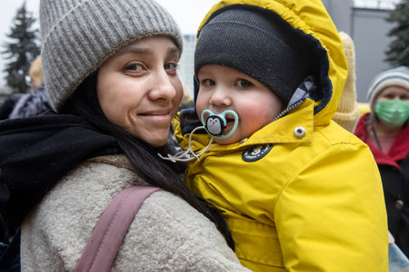 KYIV, UKRAINE - Mar. 03, 2022: War of Russia against Ukraine. Civilians evacuated from Irpen town was transferred to Kyiv by Kyiv territorial defense battalion. War refugees in Ukraineのeditorial素材