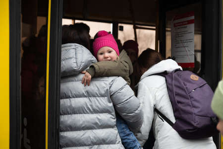 KYIV, UKRAINE - Mar. 03, 2022: War of Russia against Ukraine. Civilians evacuated from Irpen town was transferred to Kyiv by Kyiv territorial defense battalion. War refugees in Ukraineのeditorial素材