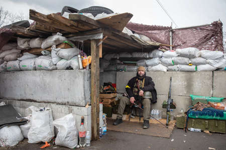 KYIV, UKRAINE - Mar. 04, 2022: War of Russia against Ukraine. Member of Kyiv territorial defense on one of Kyiv's checkpointのeditorial素材