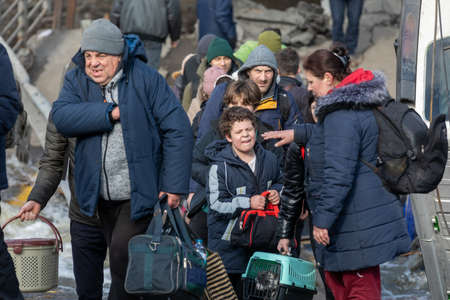 IRPIN, UKRAINE - Mar. 09, 2022: War in Ukraine. Thousands of residents of Irpin have to abandon...