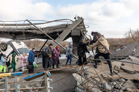 IRPIN, UKRAINE - Mar. 09, 2022: War in Ukraine. Thousands of residents of Irpin have to abandon...