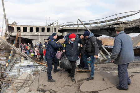 IRPIN, UKRAINE - Mar. 09, 2022: War in Ukraine. Thousands of residents of Irpin have to abandon...