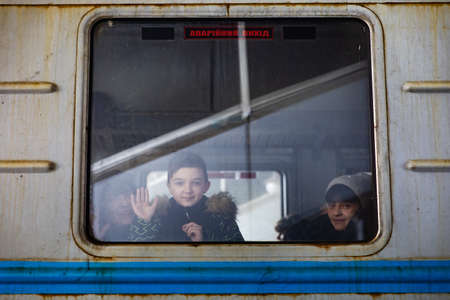 KYIV, UKRAINE - Mar. 11, 2022: War refugees in Ukraine. People at the Kyiv railway station are...