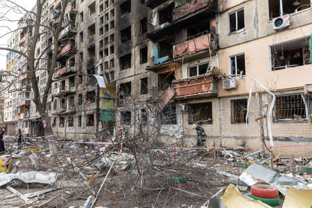 KYIV, UKRAINE - Mar. 14, 2022: War in Ukraine. Completely destroyed residential building that was...
