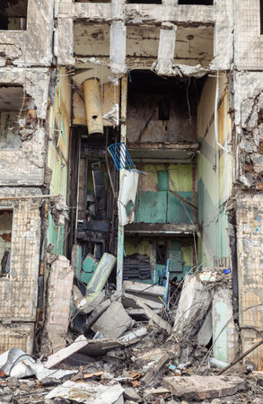 KYIV, UKRAINE - Mar. 14, 2022: War in Ukraine. Completely destroyed residential building that was hit by a shell, as Russia's attack on Ukraine continues, in the Obolon district in Kyivのeditorial素材