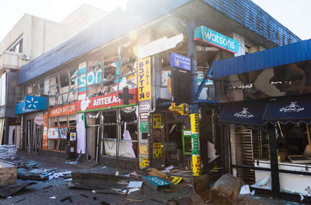 KYIV, UKRAINE - Mar. 15, 2022: War in Ukraine. Damaged houses, chaos and devastation on the streets...