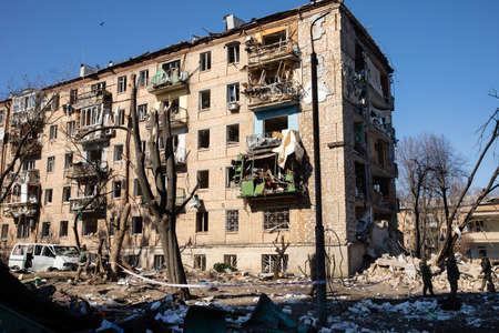 KYIV, UKRAINE - Mar. 18, 2022: War in Ukraine. Damaged residential buildings in the aftermath of a...
