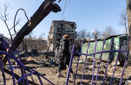 KYIV, UKRAINE - Mar. 18, 2022: War in Ukraine. Damaged residential buildings in the aftermath of a...