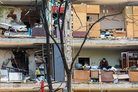 KYIV, UKRAINE - Mar. 18, 2022: War in Ukraine. Damaged residential buildings in the aftermath of a...