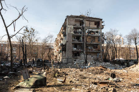 KYIV, UKRAINE - Mar. 18, 2022: War in Ukraine. Damaged residential buildings in the aftermath of a...