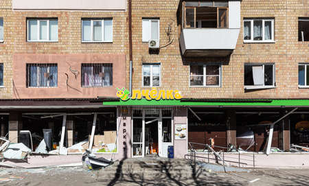 KYIV, UKRAINE - Mar. 18, 2022: War in Ukraine. Damaged residential buildings in the aftermath of a...