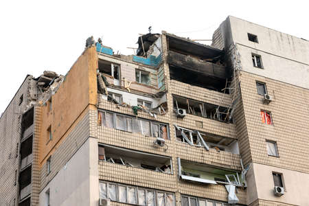 KYIV, UKRAINE - Mar. 31, 2022: War in Ukraine. Residential building damaged by falling debris after...