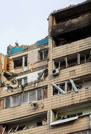 KYIV, UKRAINE - Mar. 31, 2022: War in Ukraine. Residential building damaged by falling debris after Russian rocket attack on Kyivのeditorial素材
