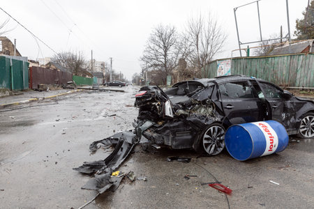 BUCHA, UKRAINE - Apr. 03, 2022: Chaos and devastation on the streets of Bucha after the exit of the Russian occupation troops from the city. Destroyed carのeditorial素材