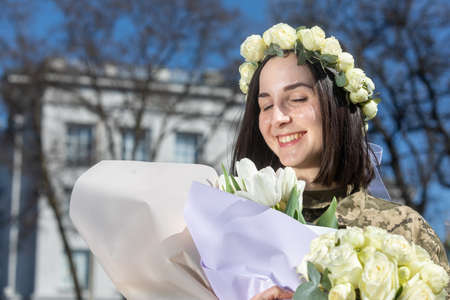KYIV, UKRAINE - Apr. 07, 2022: War and Love. Members of the Kyiv territorial defense married in Kyiv under the laws of martial law, Kyiv, Ukraineのeditorial素材
