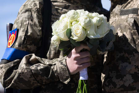 KYIV, UKRAINE - Apr. 07, 2022: War and Love. Members of the Kyiv territorial defense married in Kyiv under the laws of martial law, Kyiv, Ukraineのeditorial素材