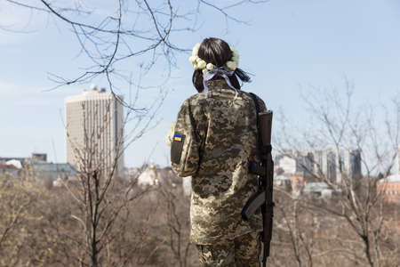 KYIV, UKRAINE - Apr. 07, 2022: War and Love. Members of the Kyiv territorial defense married in Kyiv under the laws of martial law, Kyiv, Ukraineのeditorial素材