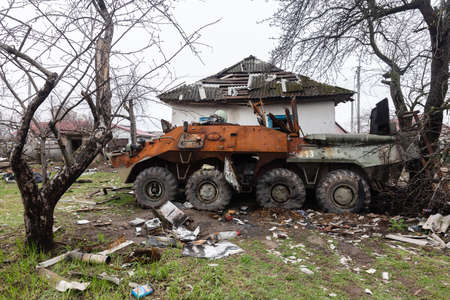 Chernihiv reg., Ukraine - Apr 20, 2022: Burnt cars and destroyed military equipment on the streets of the village as a result of an attack by Russian invadersのeditorial素材