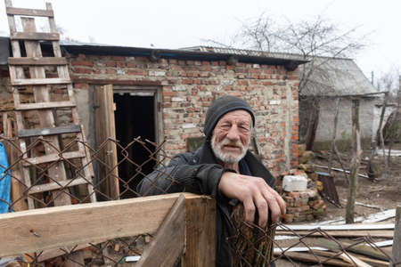 Chernihiv reg., Ukraine - Apr 20, 2022: 69 years old man, resident of the village Yahidne, whose house and household was completely destroyed while village was under Russian occupation.のeditorial素材