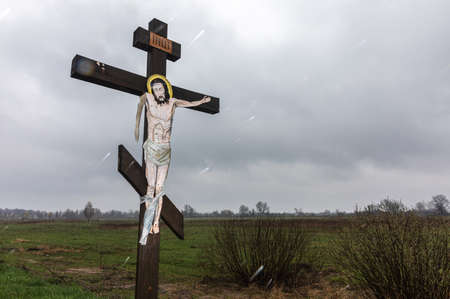 Blystavycia village, Kyiv reg, Ukraine, Apr. 22, 2022: Crucifixion of Christ with lowered hand. Where there was a Russian world, even Jesus hands fall.のeditorial素材