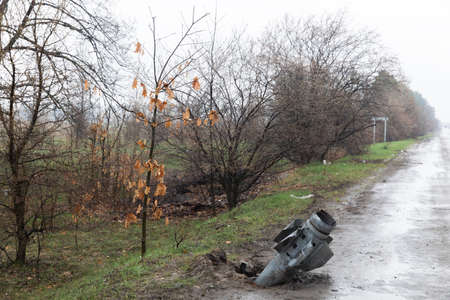 HOSTOMIL Reg, UKRAINE - Apr. 22, 2022: An unexploded rocket of the Russian occupying troops sticks out of the roadのeditorial素材