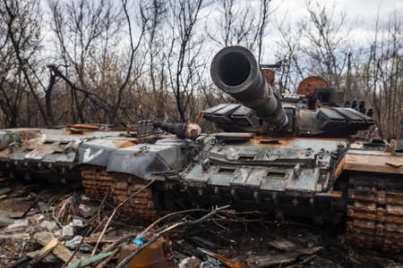 KYIV Reg, UKRAINE - Apr. 23, 2022: Destroyed and burned tanks and other military equipment of the...