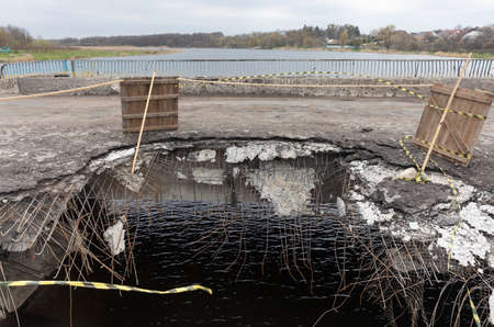 MAKARIV, KYIV REG., UKRAINE - Apr. 23, 2022: War of Russia against Ukraine. Damaged bridge in the...