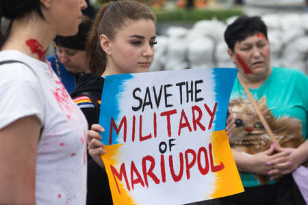 KYIV, UKRAINE - May 23, 2022: Wifes, mothers, kids of Ukrainian soldiers and members of Azov Battalion attend a rally to help organize a humanitarian corridor for the evacuation from Mariupolのeditorial素材