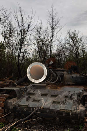 MAKARIV, KYIV REG., UKRAINE - May 07, 2022: Destroyed and burned tanks of the Russian invaders near Makariv village, Kyiv region, Ukraineのeditorial素材