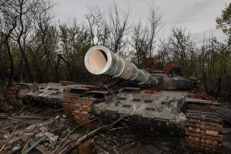 MAKARIV, KYIV REG., UKRAINE - May 07, 2022: Destroyed and burned tanks of the Russian invaders near Makariv village, Kyiv region, Ukraineのeditorial素材