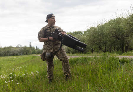 KYIV, UKRAINE - May 14, 2022: A serviceman holds an anti-drone rifle purchased with funds raised...