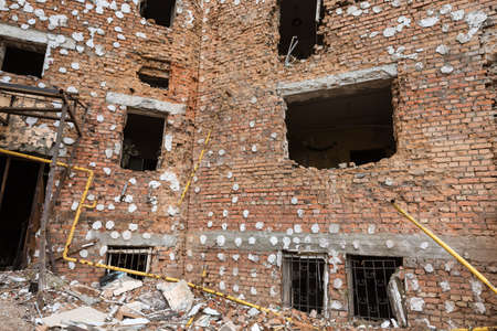 IRPIN, UKRAINE - May. 13, 2022: War of Russia against Ukraine. A residential building damaged by russian invaders in Irpin. Devastation and chaos as a result of Russia's military invasion of Ukraineのeditorial素材