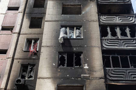 IRPIN, UKRAINE - May. 13, 2022: War of Russia against Ukraine. A residential building damaged by russian invaders in Irpin. Devastation and chaos as a result of Russia's military invasion of Ukraineのeditorial素材