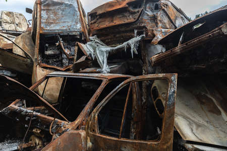 IRPIN, UKRAINE - Jun. 17, 2022: War in Ukraine. Cars destroyed amid Russias attack on Ukraine are seen, after they were collected from different places, in Irpin, Kyiv regionのeditorial素材