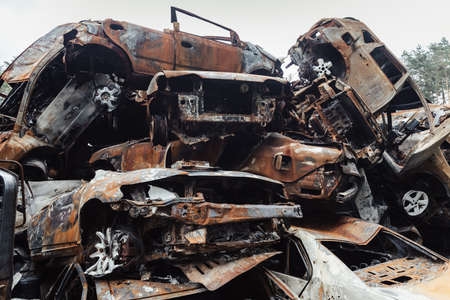 IRPIN, UKRAINE - Jun. 17, 2022: War in Ukraine. Cars destroyed amid Russias attack on Ukraine are seen, after they were collected from different places, in Irpin, Kyiv regionのeditorial素材