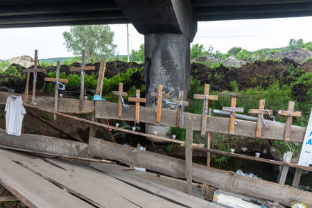 IRPIN, UKRAINE - Jun. 17, 2022: War of Russia against Ukraine. Crosses are attached to the destroyed...