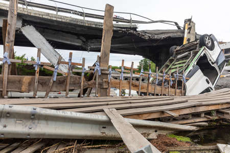 IRPIN, UKRAINE - Jun. 17, 2022: War of Russia against Ukraine. Crosses are attached to the destroyed Irpin bridge, Irpin town, Ukraineのeditorial素材