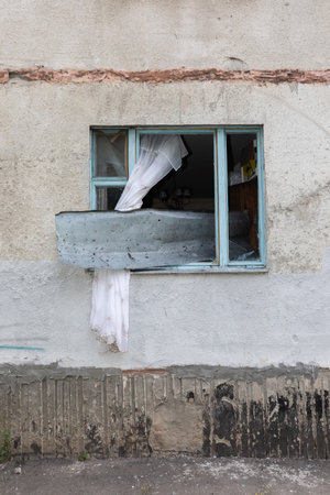 KHARKIV, UKRAINE - Aug. 01, 2022: Destroyed building in historical downtown as a consequence of Russian shelling in Kharkiv. War of Russia against Ukraine.のeditorial素材