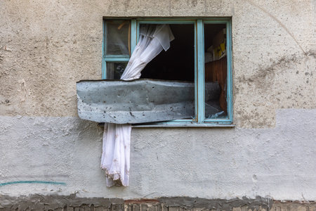 KHARKIV, UKRAINE - Aug. 01, 2022: Destroyed building in historical downtown as a consequence of Russian shelling in Kharkiv. War of Russia against Ukraine.のeditorial素材