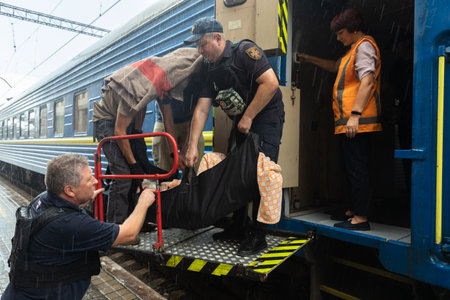 POKROVSK, DONETSK reg, UKRAINE - Aug. 04, 2022: War in Ukraine. Refugees awaiting evacuation. Evacuation train from Pokrovsk last railway station in Donetsk region, Ukraine.のeditorial素材