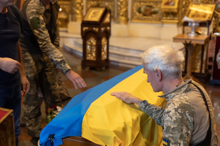 KYIV, UKRAINE - Aug. 25, 2022: Funerals of the Ukrainian soldier Yuriy Karakai who died from mortar fire in the battle in Kherson regionのeditorial素材
